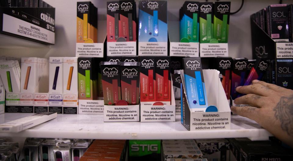 Various brands and flavors of disposable vape devices at a store in the Brooklyn borough of New York.