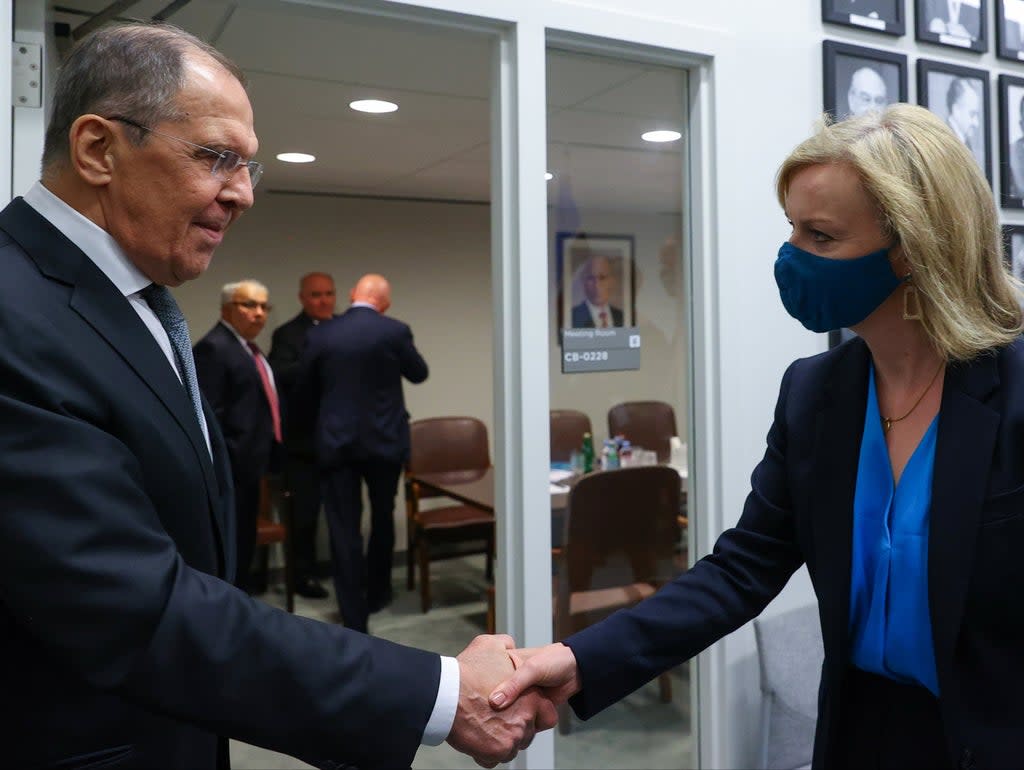 Russia’s Foreign Minister Sergei Lavrov shakes hands with Britain’s Foreign Secretary Liz Truss during a meeting on the sidelines of the 76th Session of the United Nations General Assembly on 22 September 2021 (via REUTERS)
