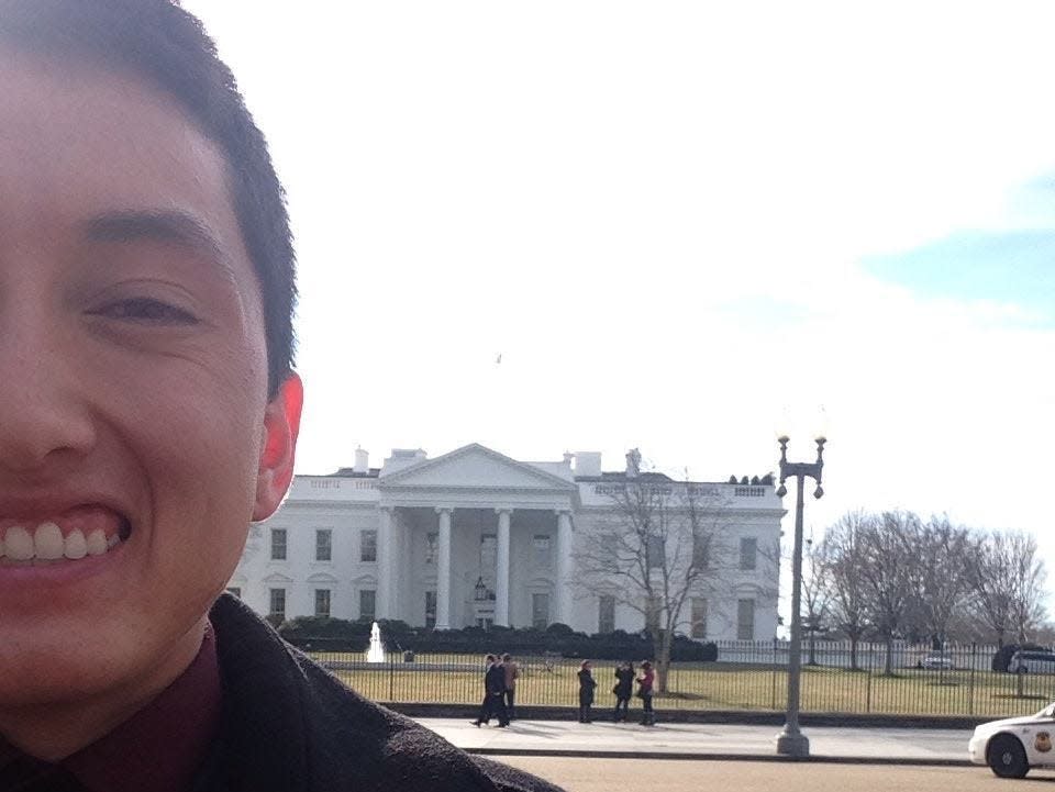 Julian Sarafian on his first day of work taking a selfie outside of the White House.