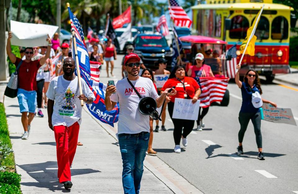 Chris Nelson, bottom-center, participates in an ÒEnd Of The Pandemic March South FloridaÓ rally in Las Olas Beach in Fort Lauderdale, Florida on Saturday, August 15, 2020.