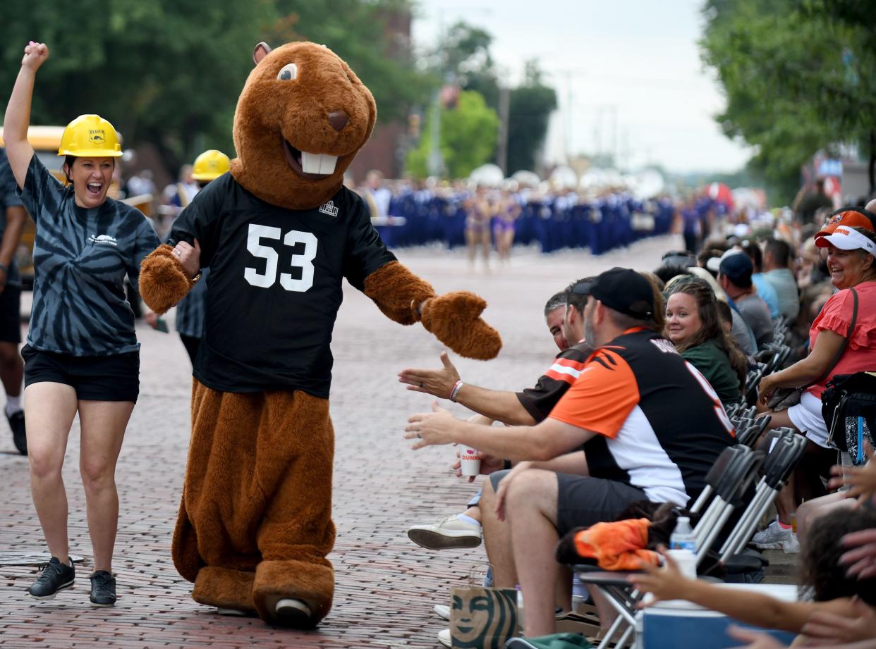 The mascot greets fans along the route of the Canton Repository Grand Parade during the 2022 Pro Football Hall of Fame Enshrinement Festival. This year's parade is expected to include more floats than last year.