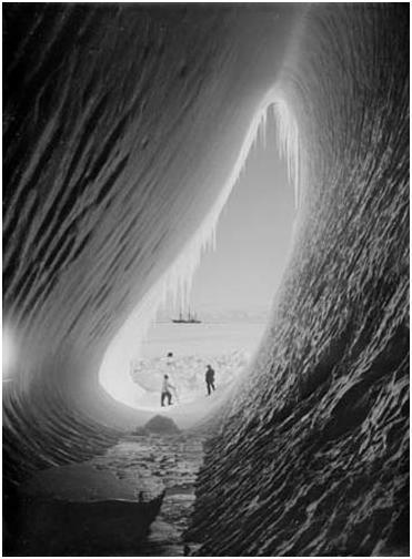 Inside an ice grotto at the South Pole. The Terra Nova ship can be seen in the background.