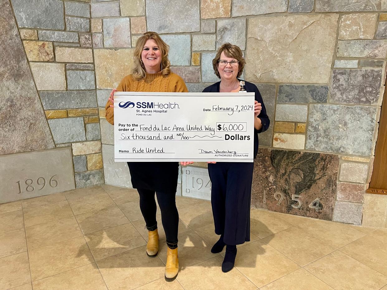 Amber Kilawee, Fond du Lac County United Way executive director, left, accepts a $6,000 donation from Dawn Vandenberg, SSM Health Wisconsin Mission Integration. The donation will help support the Ride United program, which was established in 2018 to help individuals with transportation to medical appointments, a job interview, grocery store or pharmacy. For more about Ride United, individuals can call 211.