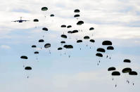 A C-17 Globemaster III drops U.S. Army Soldiers over Sicily Drop Zone during Large Package Week at Fort Bragg, Fayetteville, North Carolina. Large Package Week is a Joint Army and Air Force training exercise designed to improve Joint Airborne combat and contingency capabilities (Melissa Goslin/USAF/Rex Features)