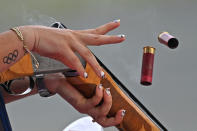 <p>A tattoo of the Olympic rings are seen on the wrist of USA's Kayle Browning as she competes in the women's trap qualification during the Tokyo 2020 Olympic Games at the Asaka Shooting Range competes in the Nerima district of Tokyo on July 29, 2021. (Photo by Tauseef MUSTAFA / AFP)</p> 