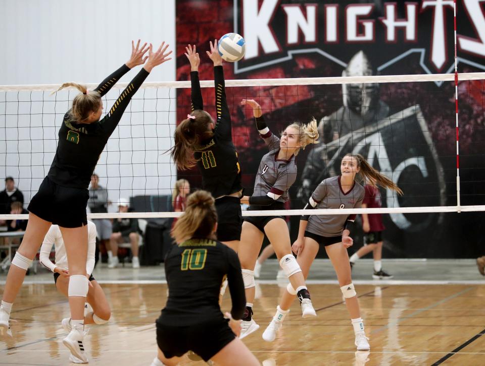 Aberdeen Christian outside hitter Mary Fites goes up for a ball during a contest against Aberdeen Roncalli. Fites led the Knights to their first state tournament bid in school history.