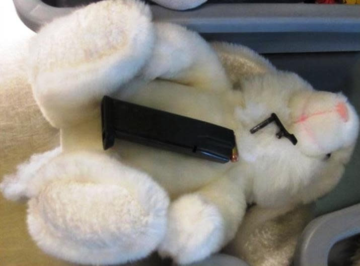 This undated photo provided by the federal Transportation Security Administration shows pistol parts hidden in a stuffed animal found by TSA officials at T.F. Green Airport in Warwick, R.I., Monday May 7, 2012. The TSA said Tuesday that a man traveling to Detroit with his 4-year-old son was stopped when a TSA officer noticed the disassembled gun components "artfully concealed" inside three stuffed animals. The stuffed animals were inside a carry-on bag that was put through an x-ray machine as part of normal security screening. (AP Photo/Transportation Security Administration)