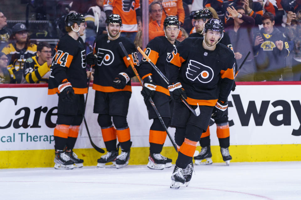 Philadelphia Flyers' Joel Farabee, right, looks on after celebrating his goal with teamates during the second period of an NHL hockey game against the Boston Bruins, Sunday, April 9, 2023, in Philadelphia. (AP Photo/Chris Szagola)