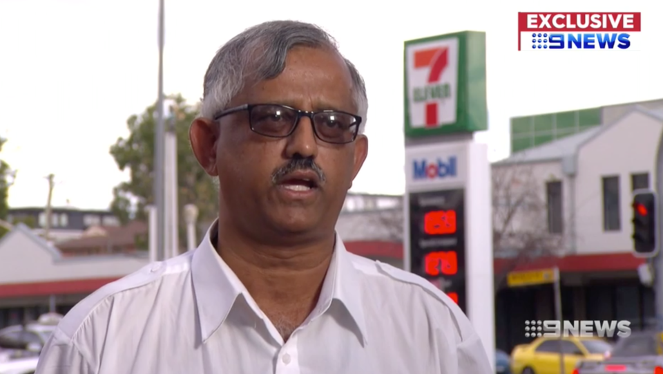 Sydney taxi driver Khairul Bashar is pictured speaking outside a 7-Eleven petrol station.