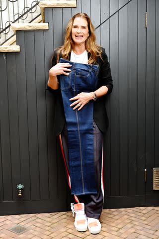<p>Marvin Joseph/The Washington Post via Getty</p> Brooke Shields poses with a part of her original Calvin Klein jeans in 2021