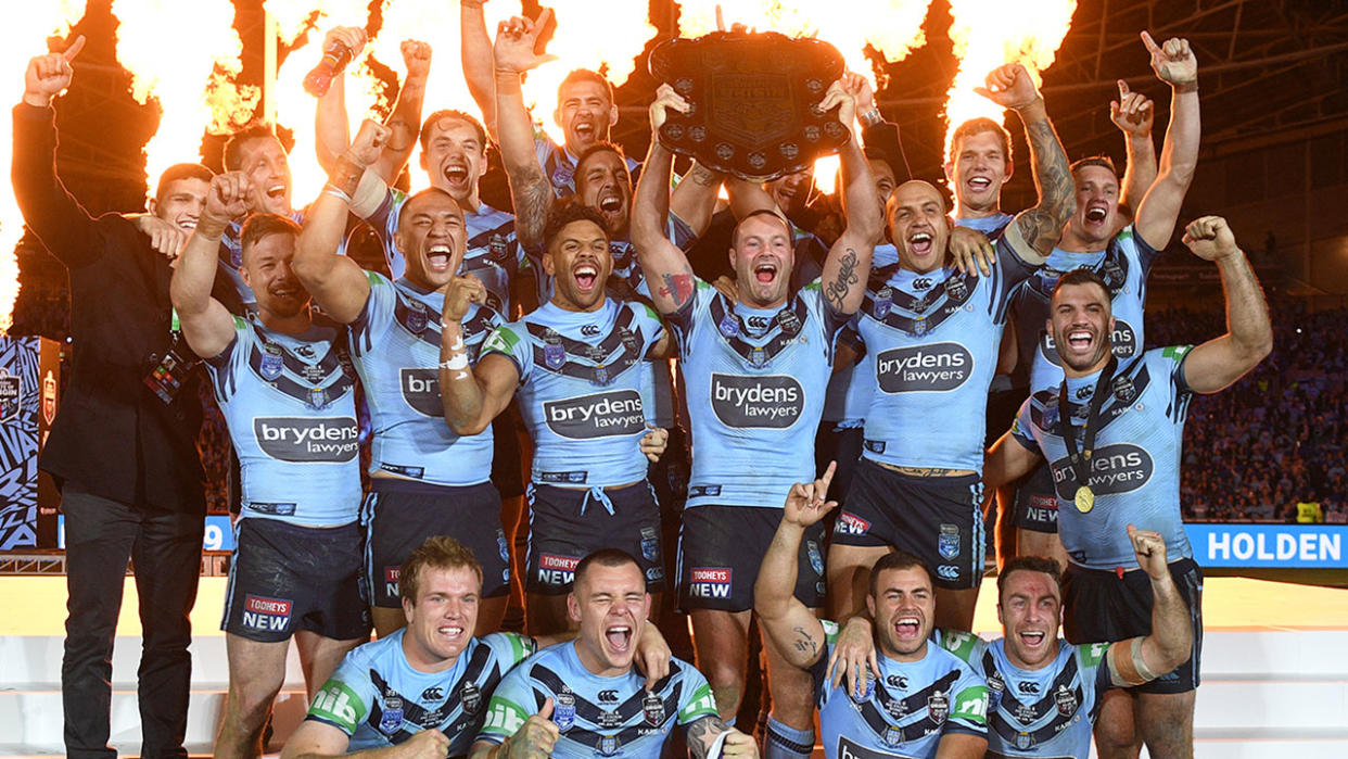 Pictured here, the NSW Blues celebrate after winning the 2019 State of Origin shield.