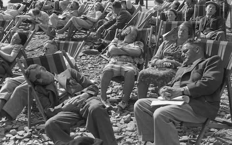 Sleeping in deckchairs - Credit: getty