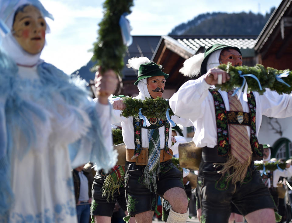 <p>So-called “Schellenruehrer” (bell ringers) carnival characters parade through the streets of Mittenwald, southern Germany, as the hot carnival season starts on Women’s Carnival, Feb. 23, 2017. (Photo: Angelika Warmuth/AFP/Getty Images) </p>