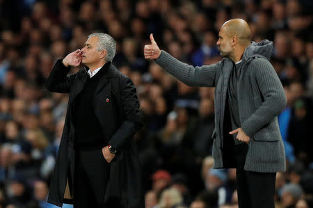 Soccer Football - Premier League - Manchester City v Manchester United - Etihad Stadium, Manchester, Britain - November 11, 2018 Manchester United manager Jose Mourinho and Manchester City manager Pep Guardiola during the match REUTERS/Darren Staples