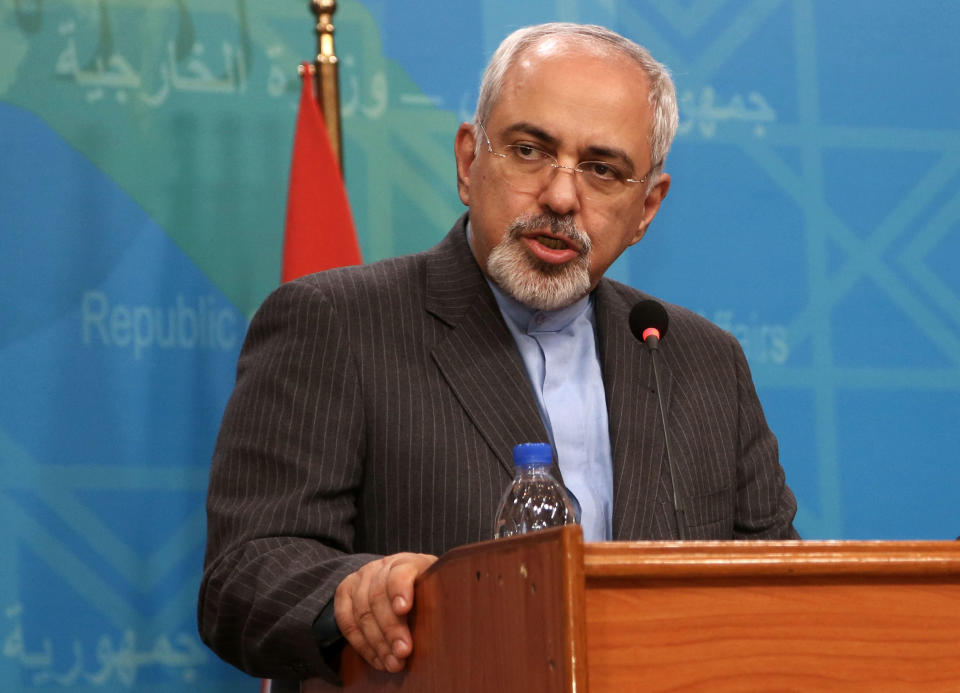 Iranian Foreign Minister Mohammad Javed Zarif speaks to the media during a joint press conference with his Iraqi counterpart Hoshyar Zebari in Baghdad, Iraq, Tuesday, Jan. 14, 2014. (AP Photo/Khalid Mohammed)