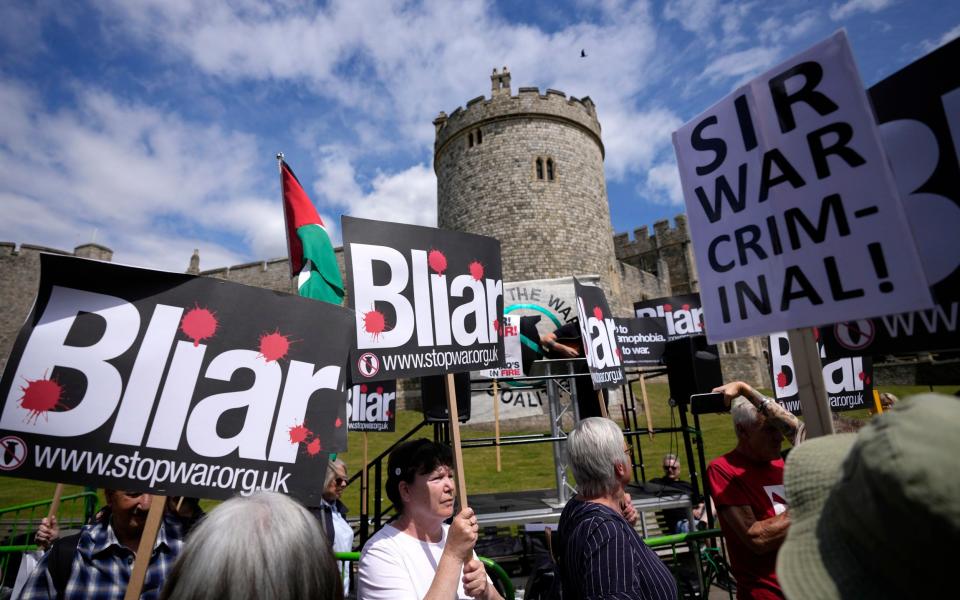 Blair's participation prompted a noisy protest outside the castle walls by around 100 Stop the War activists chanting 'Tony Blair war criminal' - Matt Dunham 