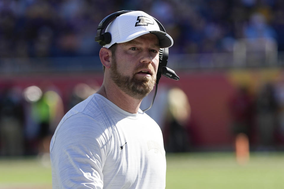 FILE - Purdue interim coach Brian Brohm walks to the sideline after a timeout during the first half of the team's Citrus Bowl NCAA college football game against LSU, Jan. 2, 2023, in Orlando, Fla. Brohm, now offensive coordinator at Louisville, will be reunited with former Purdue quarterback Jack Plummer. (AP Photo/John Raoux)