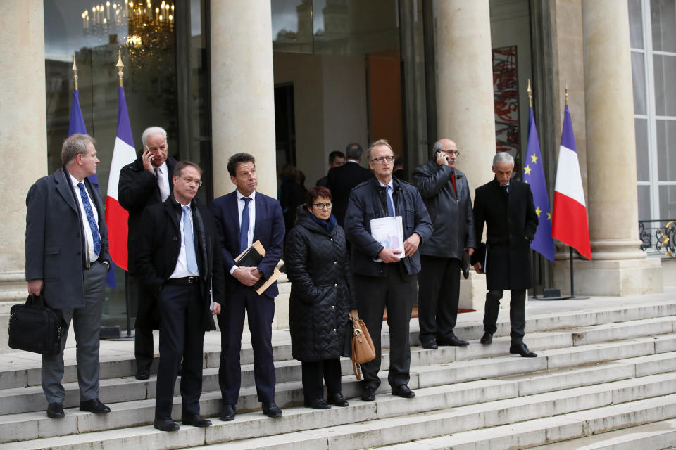 French local, national political leaders, unions, business leaders and others leave after a meeting with French President Emmanuel Macron to hear their concerns at the Elysee Palace in Paris, Monday, Dec. 10, 2018. French President Emmanuel Macron is preparing to speak to the nation at last after increasingly violent "yellow vest" protests against his leadership. (AP Photo/Francois Mori)