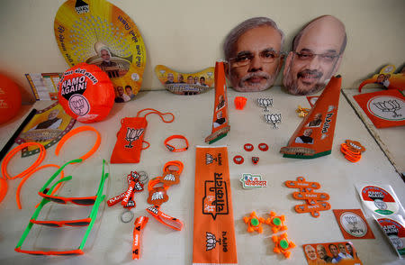 Wristbands, key chains and badges featuring India's ruling Bharatiya Janata Party (BJP) and masks of the party president Amit Shah and Prime Minister Narendra Modi are on display inside a BJP office ahead of general election in Gandhinagar, Gujarat, April 3, 2019. REUTERS/Amit Dave