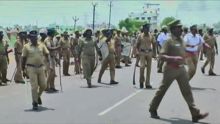 Armed policemen in anti-riot gear are seen deployed during a protest against the construction of a copper smelter by Vedanta Resources, in Thoothukudi, Tamil Nadu, India in this still image from May 22, 2018 video footage. Video taken May 22, 2018. ANI via REUTERS TV