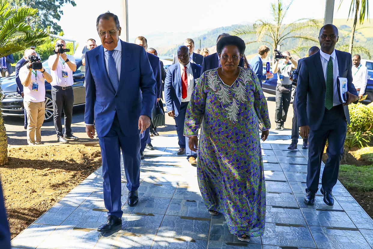 In this photo released by the Russian Foreign Ministry Press Service, Russian Foreign Minister Sergey Lavrov, left, and Eswatini's Minister of Foreign Affairs and International Cooperation Thuli Dladla walk together during their meeting in Mbabane, Eswatini, Tuesday, Jan. 24, 2023. (Russian Foreign Ministry Press Service via AP)