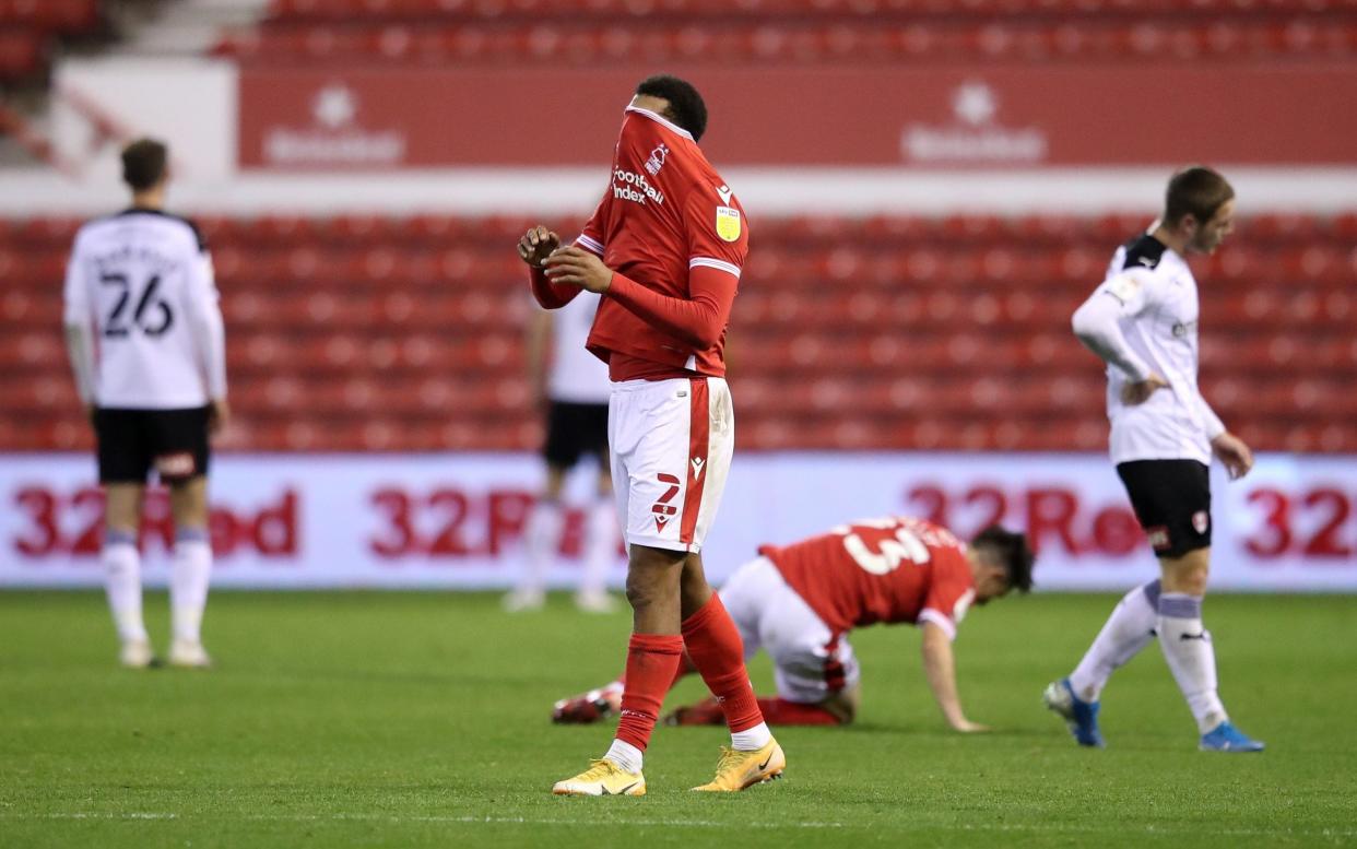 Nottingham Forest players react after a glorious late chance to win the game goes begging - GETTY IMAGES