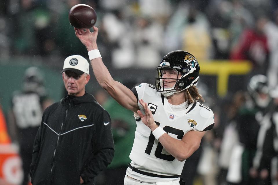 Jacksonville Jaguars quarterback Trevor Lawrence (16) warms up before playing against the New York Jets in an NFL football game, Thursday, Dec. 22, 2022, in East Rutherford, N.J. (AP Photo/Seth Wenig)