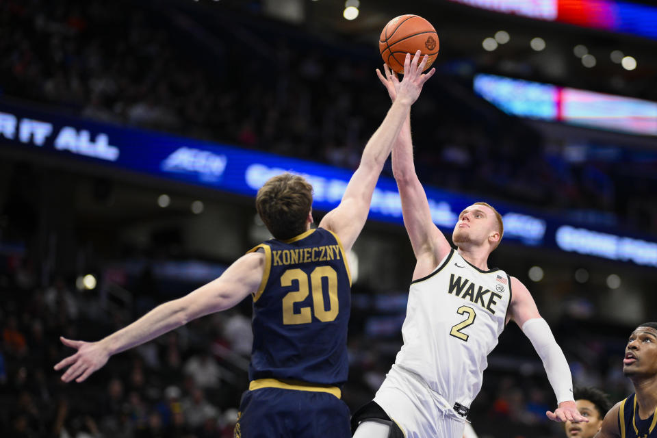 Wake Forest guard Cameron Hildreth (2) shoots over Notre Dame guard J.R. Konieczny (20) during the second half of the Atlantic Coast Conference second round NCAA college basketball tournament game Wednesday, March 13, 2024, in Washington. (AP Photo/Nick Wass)