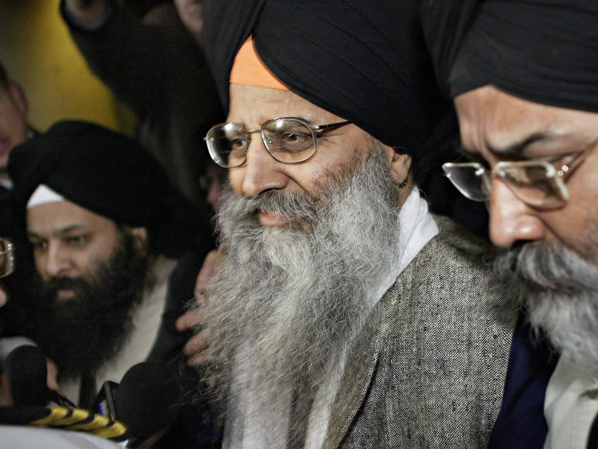 Ripudaman Singh Malik, centre, was shot and killed in Surrey Thursday. Malik was acquitted in the bombing of an Air India flight in 1985. (Richard Lam/The Canadian Press - image credit)