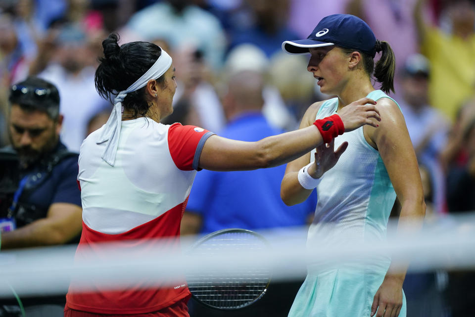 FILE - Iga Swiatek, of Poland, right, greets Ons Jabeur, of Tunisia, after winning the women's singles final of the U.S. Open tennis championships on Sept. 10, 2022, in New York. Swiatek and Jabeur are two of the tennis players featured in the new Netflix docuseries “Break Point,” which is scheduled to debut on Jan. 13, 2023. The show is from the producers of “Formula 1: Drive to Survive.” (AP Photo/Matt Rourke, File)