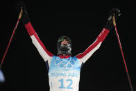 Norway's Joergen Graabak celebrates after winning the gold medal during the cross-country skiing portion of the individual Gundersen large hill/10km competition at the 2022 Winter Olympics, Tuesday, Feb. 15, 2022, in Zhangjiakou, China. (AP Photo/Alessandra Tarantino)