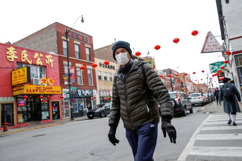 FILE PHOTO: A man wears a masks in Chinatown following the outbreak of the novel coronavirus, in Chicago