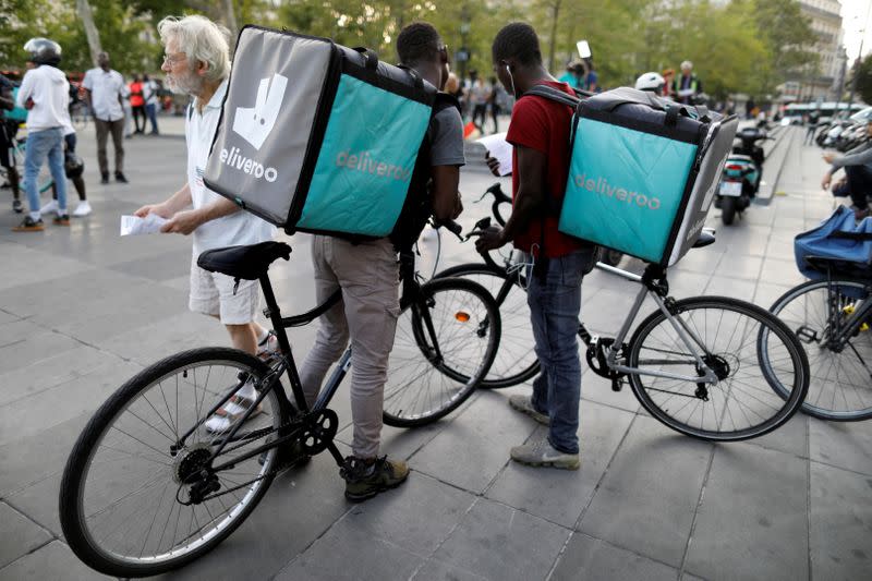 FILE PHOTO: Bikers of food courier service Deliveroo demonstrate as they called on clients to boycott the brand in Paris