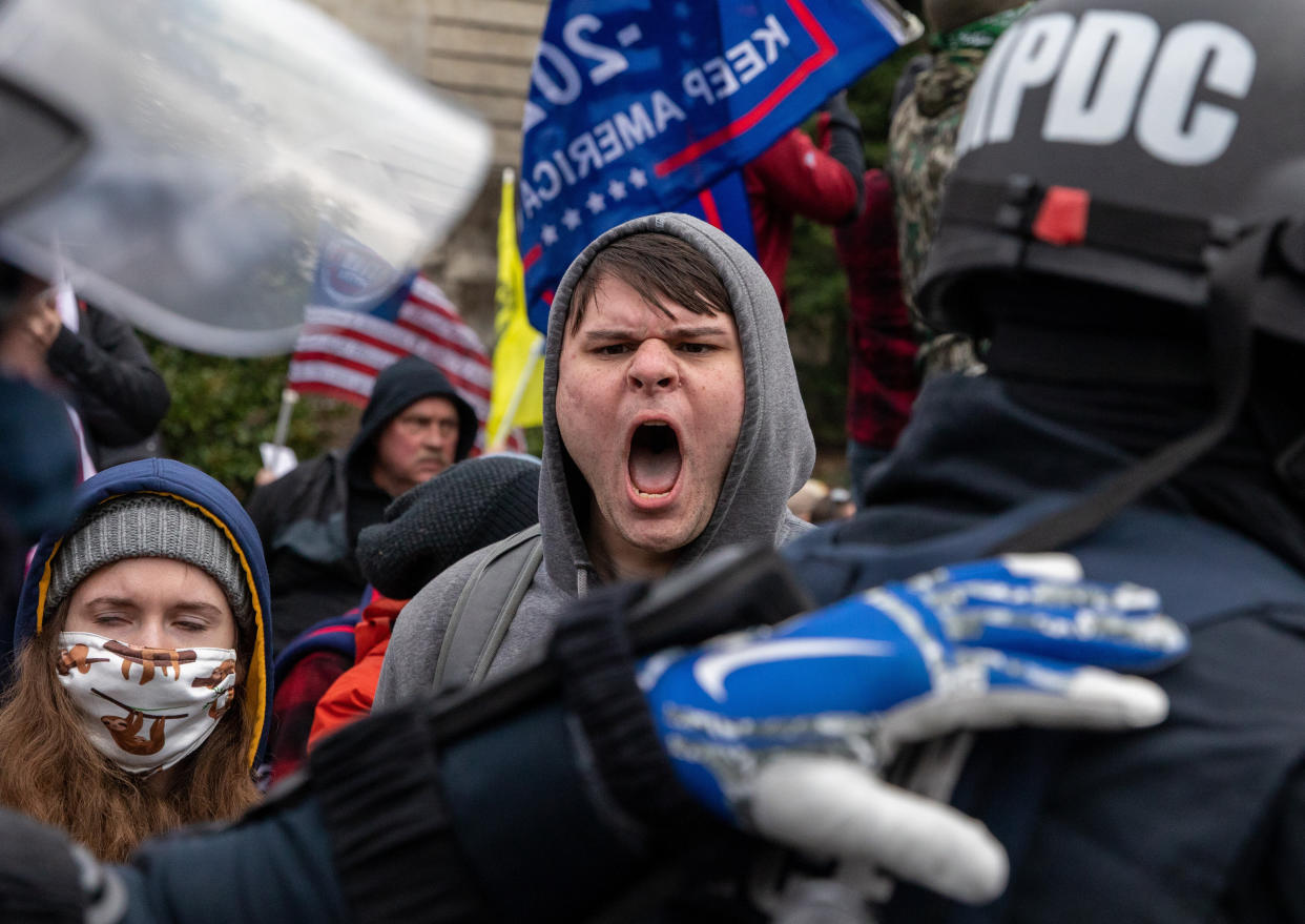 Pro-Trump rioters clash with police Wednesday before a mob broke into the U.S. Capitol. (Photo: The Washington Post via Getty Images)