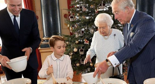 Prince George made Christmas puddings with the Queen, Prince Charles ad Prince William [Image: Getty]