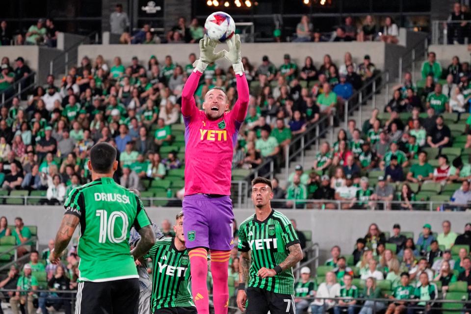 Austin FC goalkeeper Brad Stuver goes high to catch a ball against CF Montreal. El Tree won 1-0.