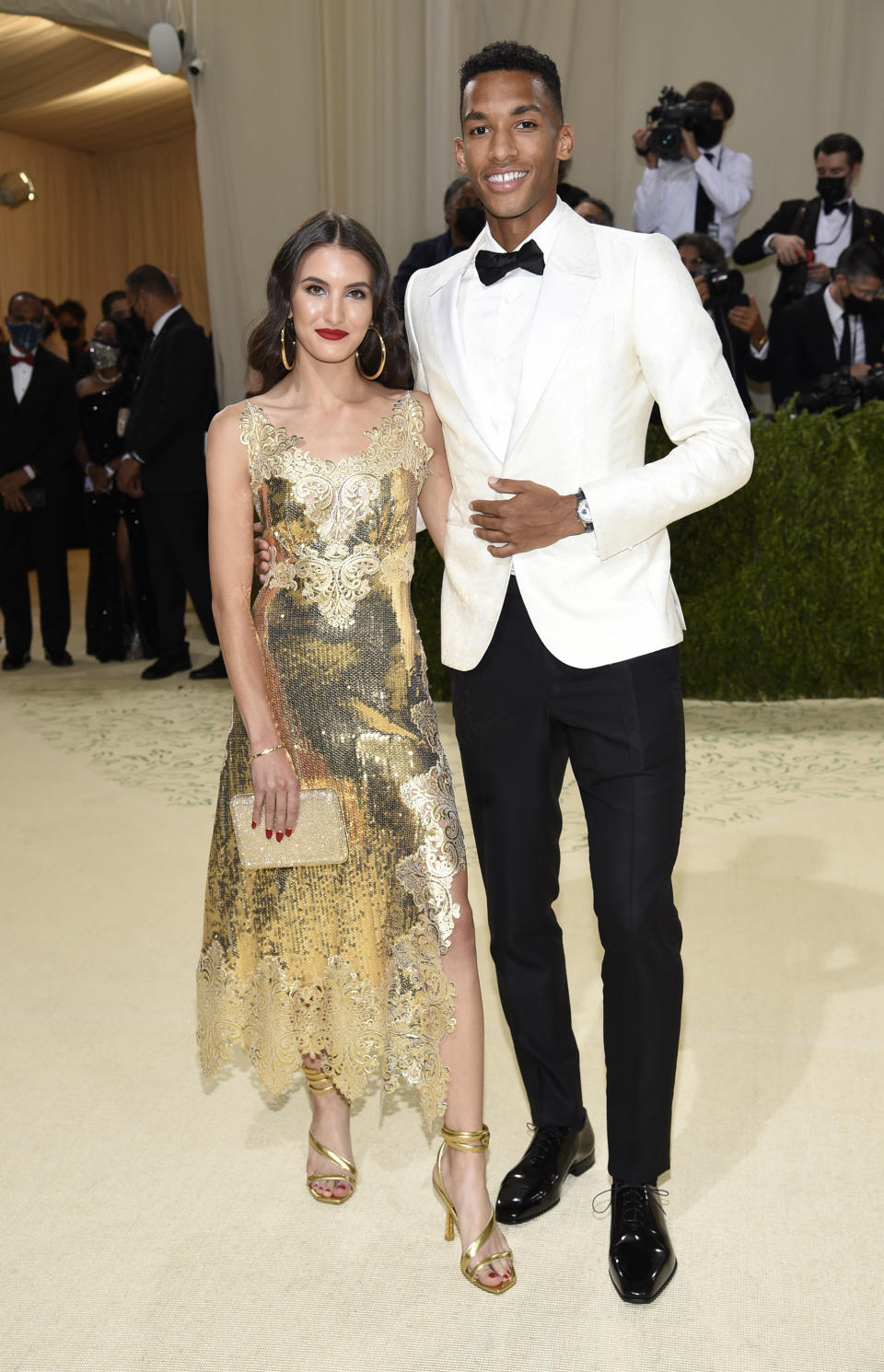 Nina Ghaibi, left, and Felix Auger Aliassime attend The Metropolitan Museum of Art's Costume Institute benefit gala celebrating the opening of the "In America: A Lexicon of Fashion" exhibition on Monday, Sept. 13, 2021, in New York. (Photo by Evan Agostini/Invision/AP)