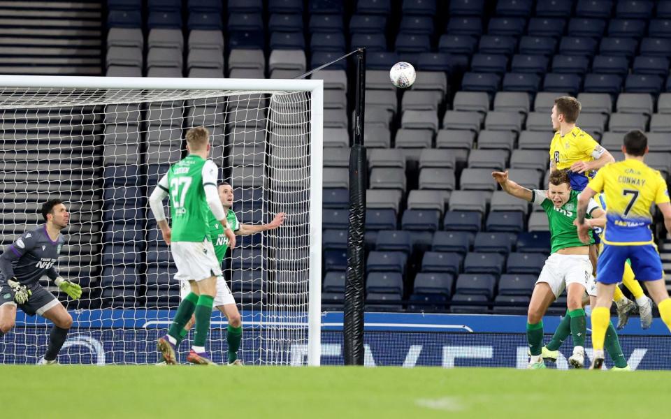 St Johnstone's Jason Kerr scores his side's first goal of the game during the Betfred Cup Semi Final match at Hampden Park - PA