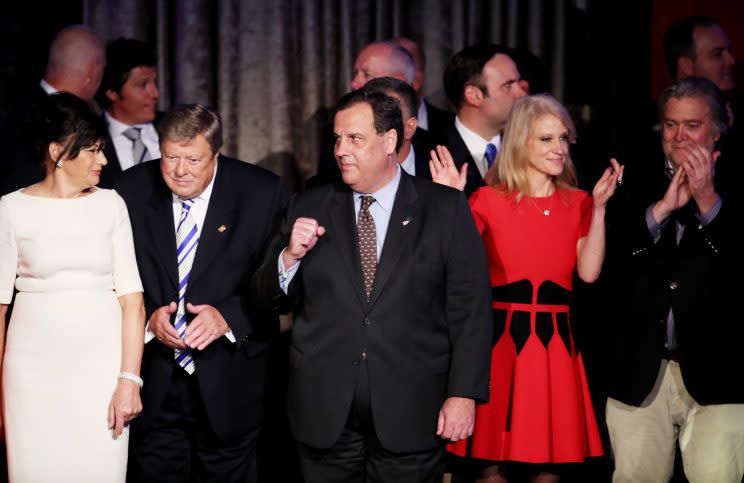 Christie stands on stage along with President-elect Trump's campaign manager, Kellyanne Conway and Trump campaign CEO Stephen Bannon. (Photo: Mark Wilson/Getty Images)