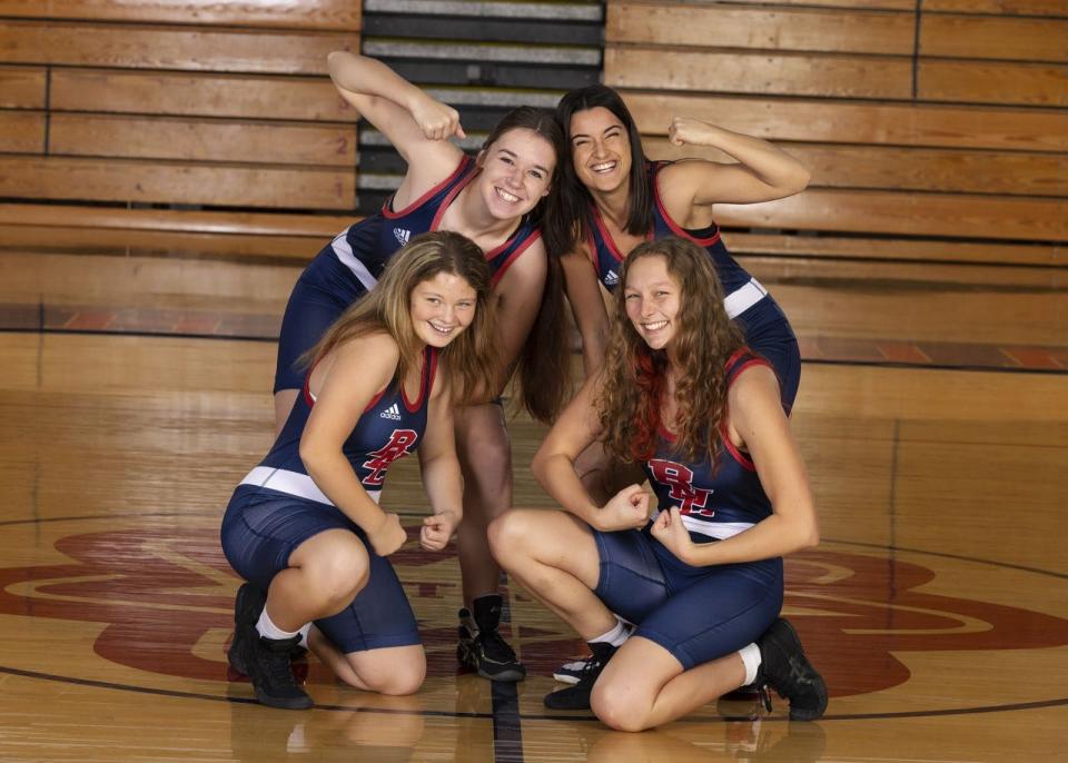 The 2021-22 BNL wrestling team features four females. They are (clockwise from back left) Katie Sites, Alessia Agostini, Samantha Biel and Alivia Crane.