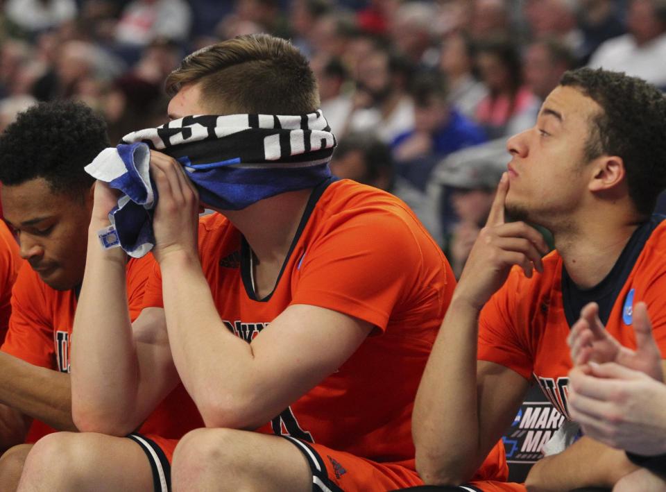 Bucknell center Nate Sestina, left, and guard John Azzinaro, right, react during the second half of a first-round men's college basketball game against West Virginia in the NCAA Tournament, Thursday, March 16, 2017, in Buffalo, N.Y. West Virginia won, 86-80. (AP Photo/Bill Wippert)