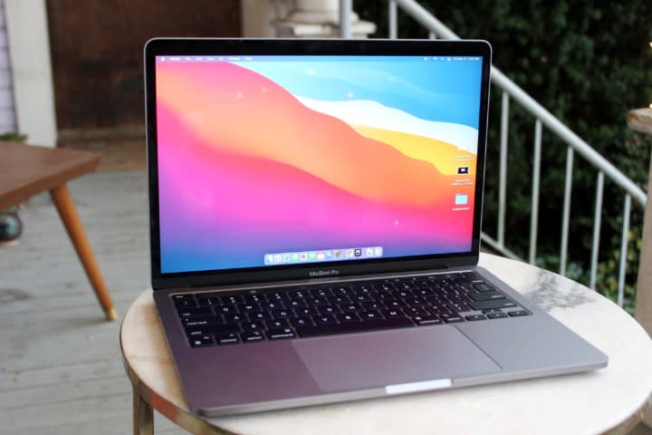 The M1-powered MacBook Pro on a coffee table.