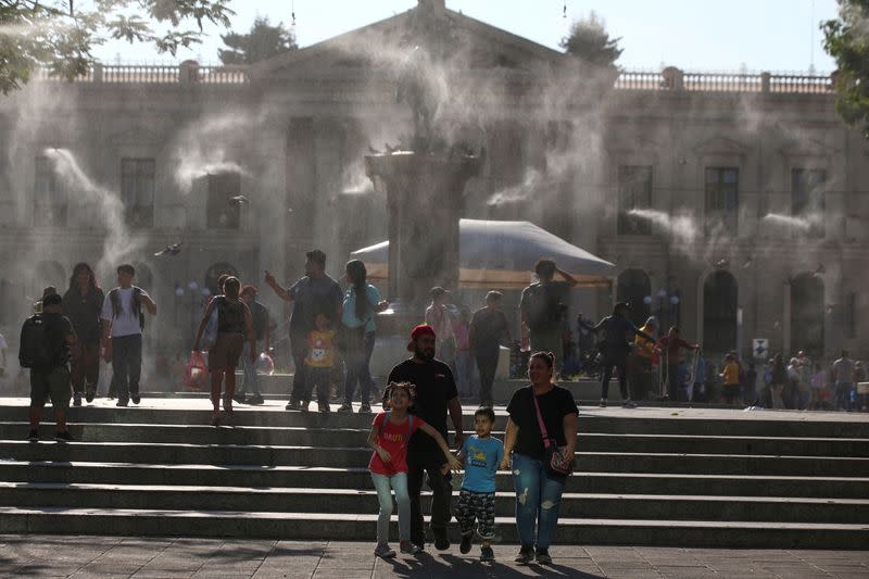FILE PHOTO: Water is sprayed by a system to alleviate the high temperatures, in San Salvador