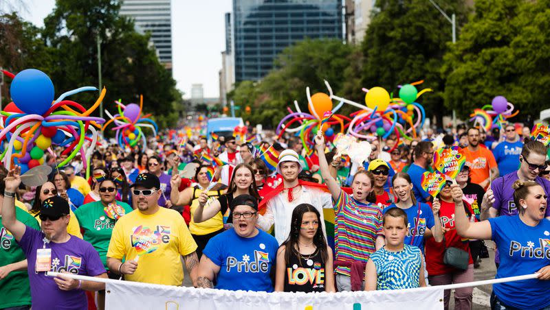 Participants walk during the 2023 Utah Pride Parade in downtown Salt Lake City on June 4, 2023.