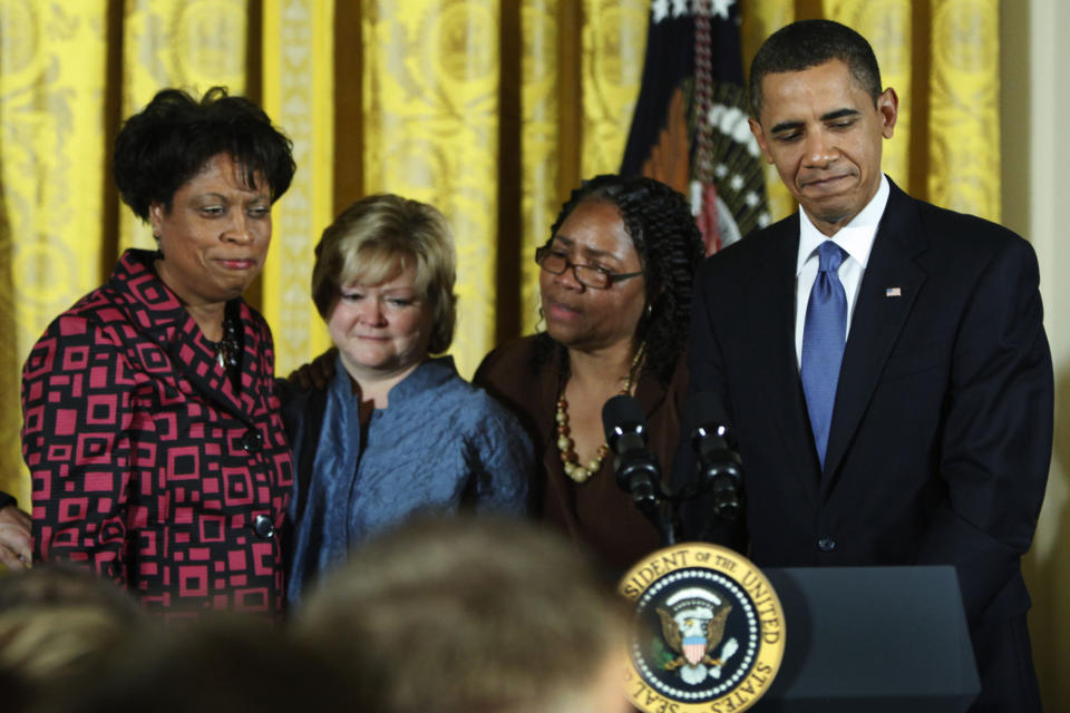 FILE - President Barack Obama, reacts with the mother of Matthew Shepard, Judy Shepard, second left, and James Byrd Jr.'s sisters, Louvon Harris, left, and Betty Byrd Boatner, second right, during a White House reception commemorating the enactment of the Matthew Shepard and James Byrd Jr. Hate Crimes Prevention Act, Wednesday, Oct. 28, 2009, in Washington. (AP Photo/Manuel Balce Ceneta, File)