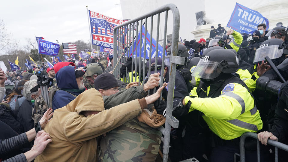 Pro-Trump rioters clash with police outside the Capitol, Jan. 6, 2021.