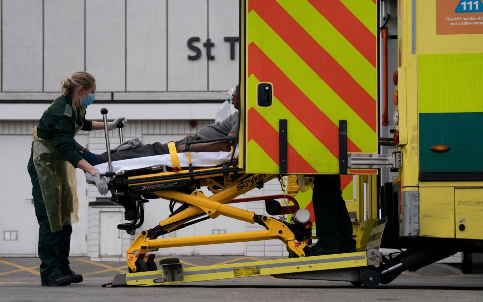 Paramedics outside St Thomas' Hospital, Central London - WILL OLIVER/Shutterstock