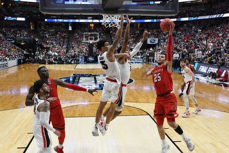 March 30, 2019; Anaheim, CA, USA; Texas Tech Red Raiders guard Davide Moretti (25) shoots against the defense of Gonzaga Bulldogs forward Brandon Clarke (15) and forward Rui Hachimura (21) during the second half in the championship game of the west regional of the 2019 NCAA Tournament at Honda Center. Mandatory Credit: Robert Hanashiro-USA TODAY Sports