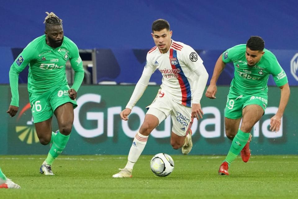 Lyon midfielder Bruno Guimaraes, centre, has been linked with Newcastle (Laurent Cipriani/PA) (AP)