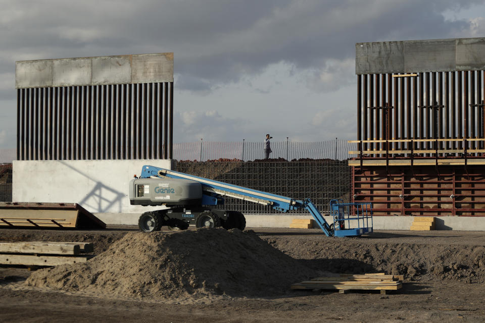 FILE - In this Nov. 7, 2019 file photo, the first panels of levee border wall are seen at a construction site along the U.S.-Mexico border, in Donna, Texas. The Trump administration said Tuesday, Feb. 18, 2020, that it will waive federal contracting laws to speed construction of the border wall with Mexico. (AP Photo/Eric Gay, File)